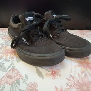 Lightly worn black vans.